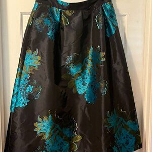Silk skirt and coordinating pink velvet bodysuit